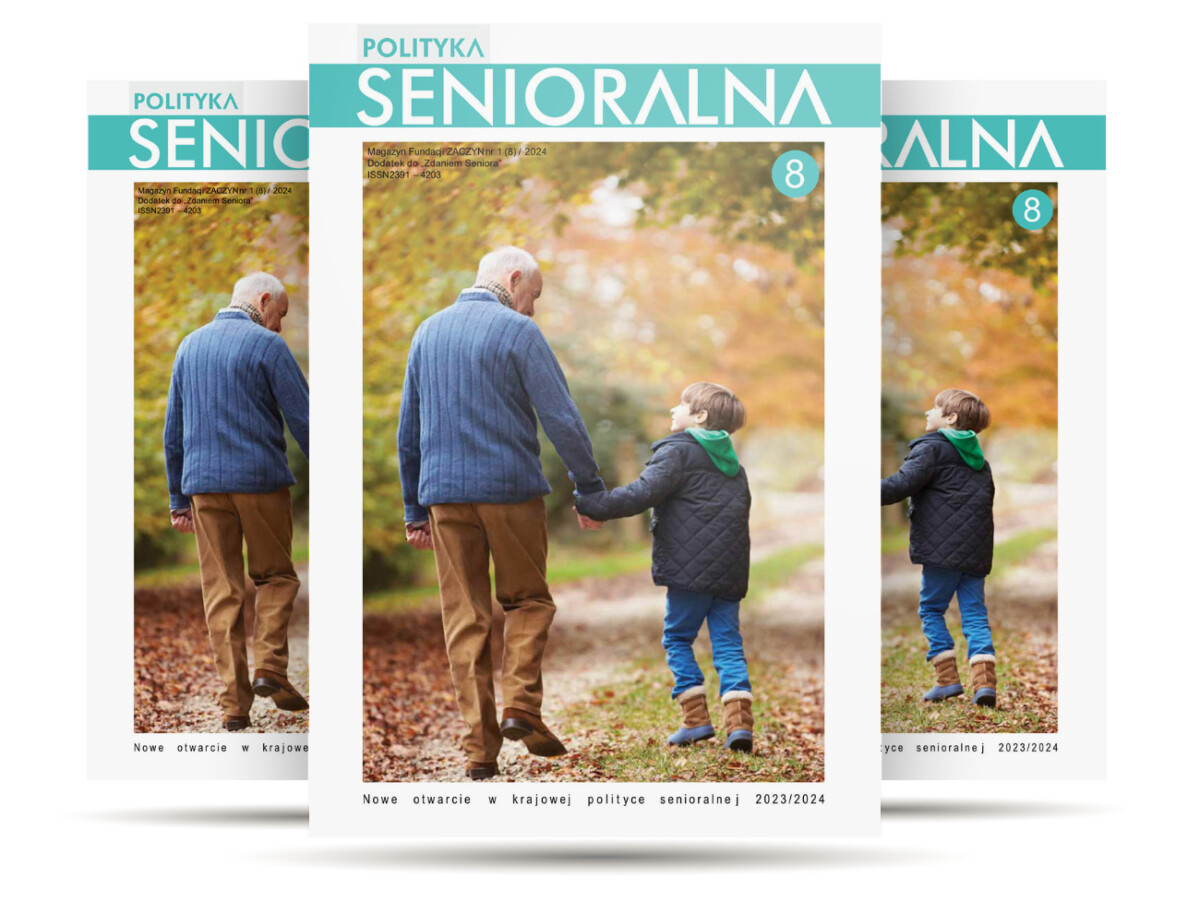 Pogodna jesień, dziadek z wnukiem spacerują ścieżką w parku, trzymają się za ręce, rozmawiają,