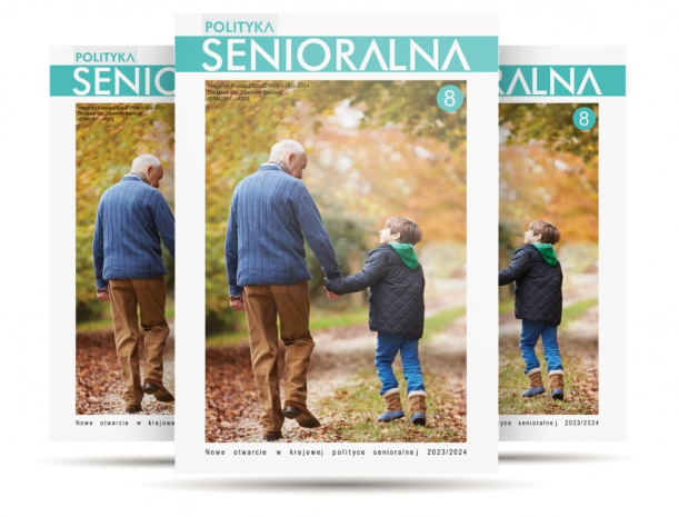 Pogodna jesień, dziadek z wnukiem spacerują ścieżką w parku, trzymają się za ręce, rozmawiają,